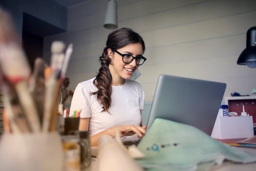 lady in glasses at laptop