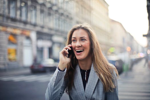 on her phone smiling